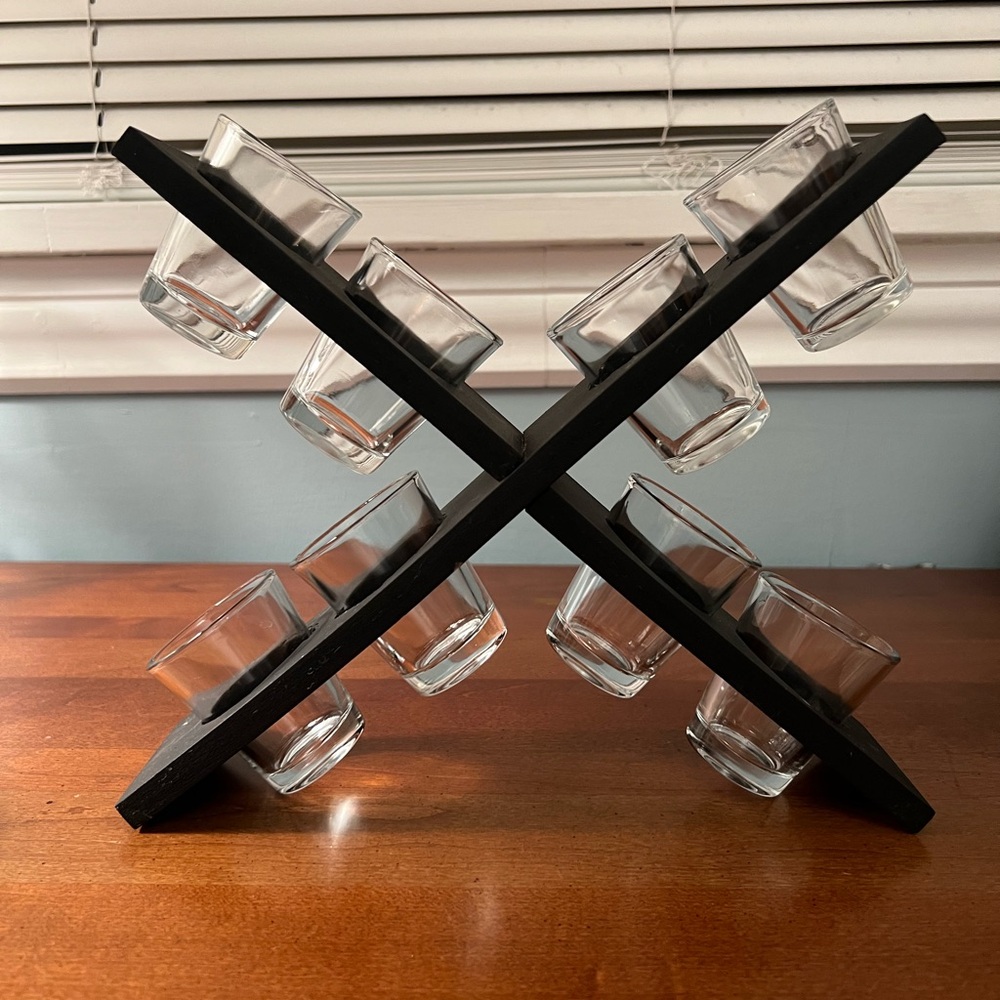 8 shot glasses and wooden caddy